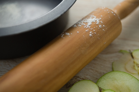 Close up of rolling pin by container on tableの写真素材