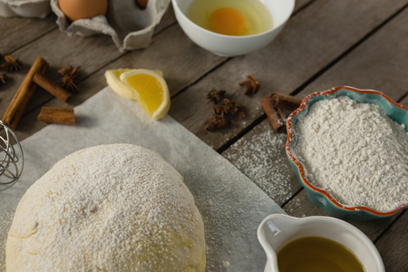 Ingredients by kneaded dough at tableの写真素材