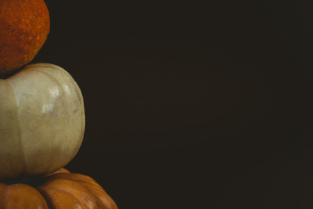 Cropped image of pumpkins arranged over black backgroundの写真素材
