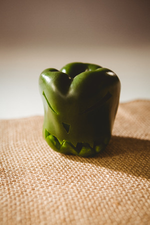 Close up of carved green bell pepper on sack