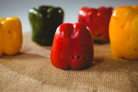 Close up of carved colorful bell peppers on sack