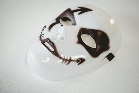 High angle view of evil mask on white backgroundの写真素材