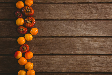 Overhead view of candies with small pumpkins arranged on tableの写真素材