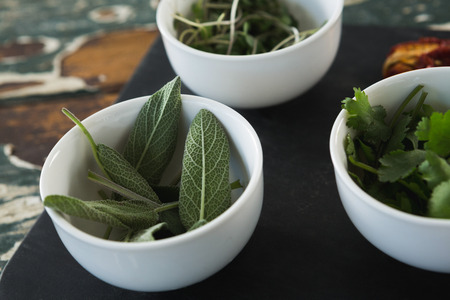 Close-up of various herbs on boradの写真素材
