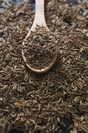 Close-up of cumin with spoonの写真素材