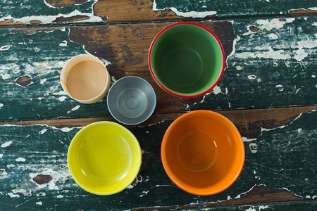 Overhead of various empty bowl on wooden tableの写真素材