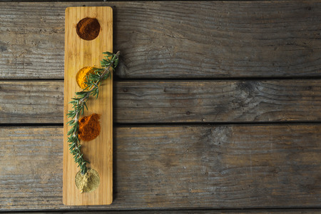Overhead of various spices in wooden containerの写真素材