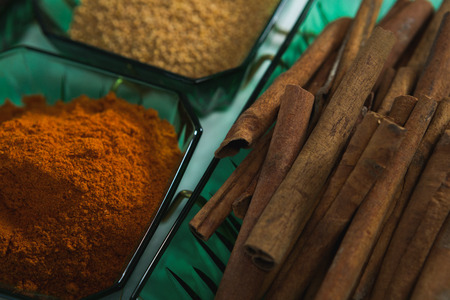 Close-up of cinnamon with spices powder in bowlの写真素材