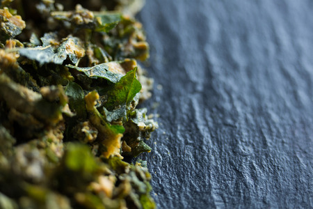 Close-up of cooked kale on wooden plateの写真素材