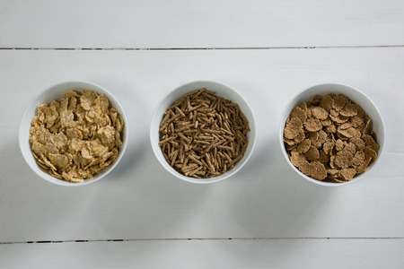 Bowls of various breakfast on white backgroundの写真素材