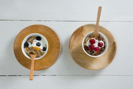 Two bowls of breakfast cereals on white backgroundの写真素材