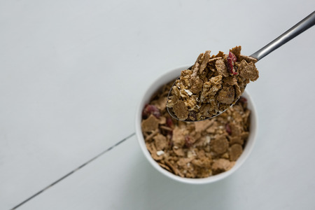 Close-up of breakfast cereal on spoonの写真素材