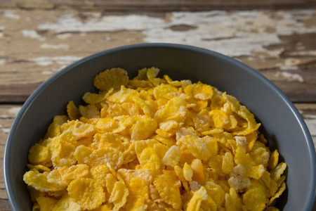 Wheaties cereal in bowl on wooden table