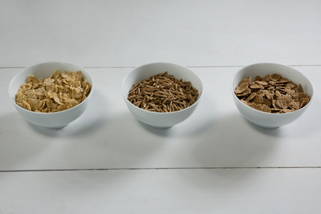 Bowls of various breakfast on white backgroundの写真素材