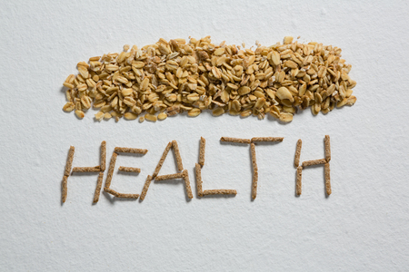 Oatmeals arranged text health on white backgroundの写真素材