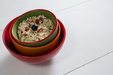 Muesli with blueberry in bowl on white backgroundの写真素材