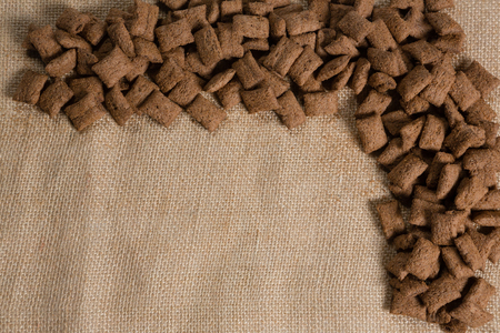 Overhead of chocolate toast crunch arranged on textileの写真素材
