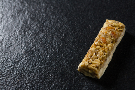 Close-up of granola bar on black backgroundの写真素材