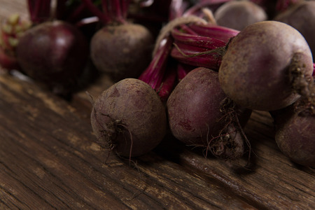 Close-up of fresh organic beetroots on wooden table