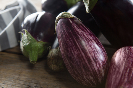 Close-up of eggplant on wooden tableの写真素材