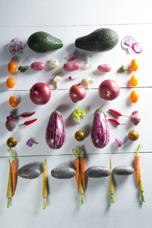 Overhead view of various vegetables arranged on tableの写真素材