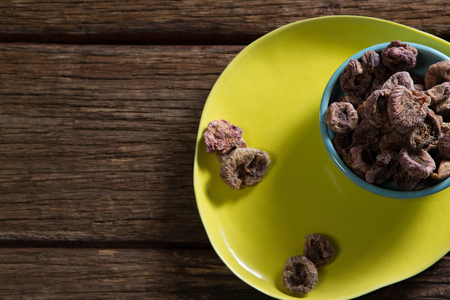 Overhead view of dried figs in a bowlの写真素材