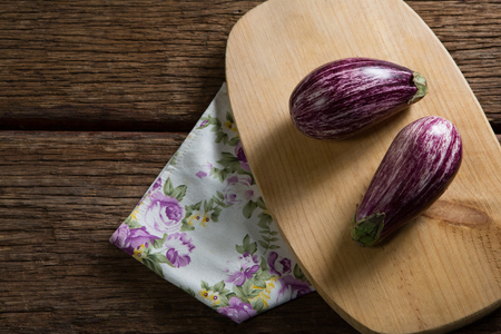 Overhead of eggplant on chopping boardの写真素材