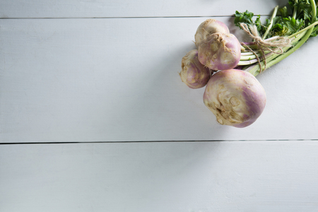 High angle view of turnips on wooden table