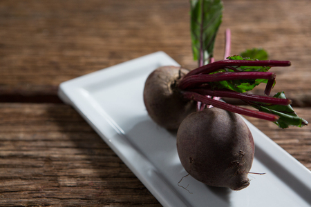 Close-up of beetroots in a tray on wooden table