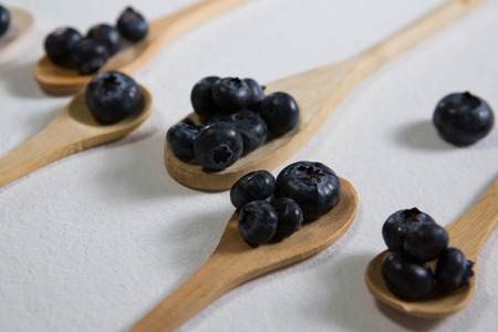 Close-up of blueberries arranged in a spoon on white backgroundの写真素材