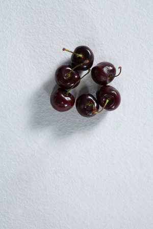 Close-up of cherry fruits on a white backgroundの写真素材