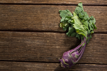 Overhead of kohlrabi on wooden tableの写真素材