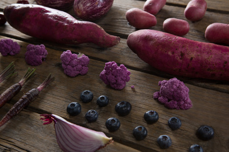Close-up of various vegetable arranged on wooden tableの写真素材
