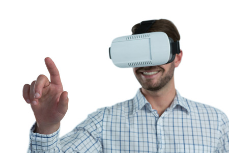Man gesturing while using virtual reality headset against white background