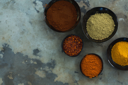 Overhead of various spices powder in bowlの写真素材