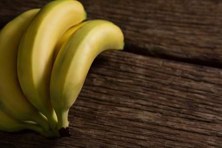 Close-up of fresh organic banana on wooden tableの写真素材