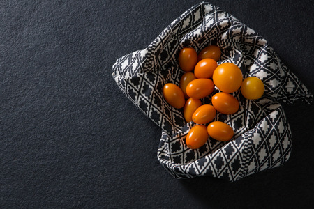 Overhead of golden berries on clothの写真素材
