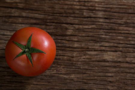 Close-up of tomato on wooden tableの写真素材