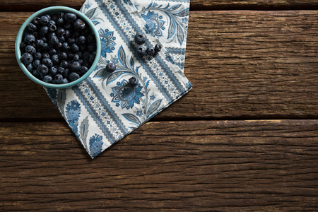 Overhead of blueberries on wooden table