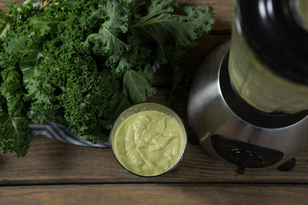 Overhead of mustard greens paste in glassの写真素材