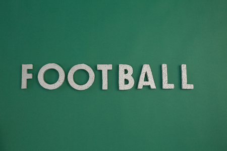 Close-up o word football arranged on green backgroundの写真素材