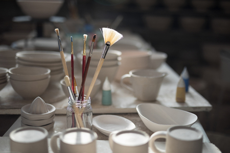 Close-up of various paint brush in pencil holderの写真素材