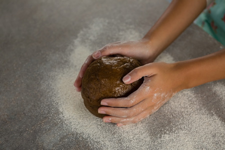 Close-up of woman holding a dough