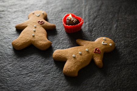 Close-up of gingerbread and chocolate on concrete background