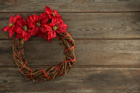 Christmas wreath on wooden plank during christmas timeの写真素材