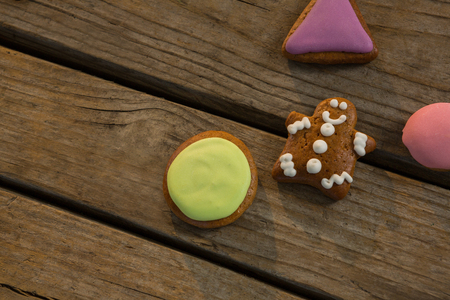 High angle view of various cookies on wooden table during Christmas
