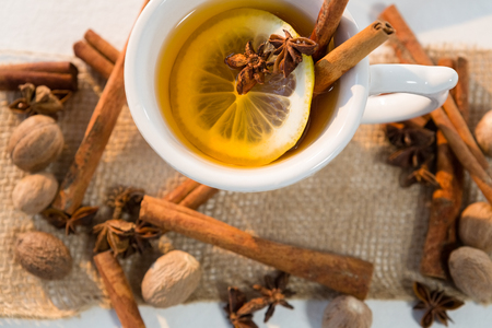 Close-up of spice tea with various ingredients on white backgroundの写真素材