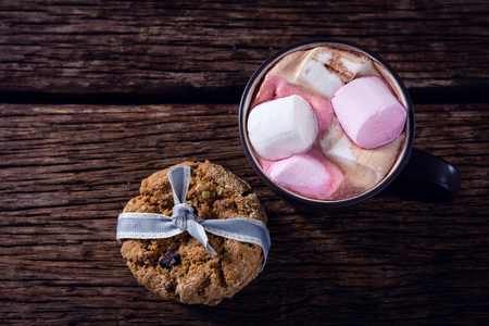 Overhead of cookies and hot chocolate on wooden plankの写真素材