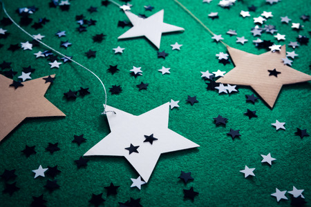 Close-up of handmade stars on green backgroundの写真素材