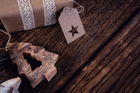 Close-up of gift boxes and christmas decoration on wooden plankの写真素材